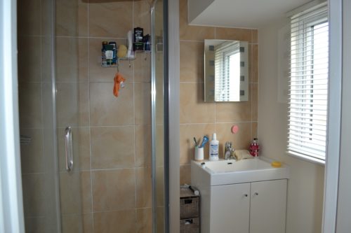 En-suite bathroom, shower and sink