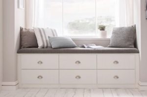 How to make small rooms feel larger with hidden storage, window seat with drawers for storage underneath